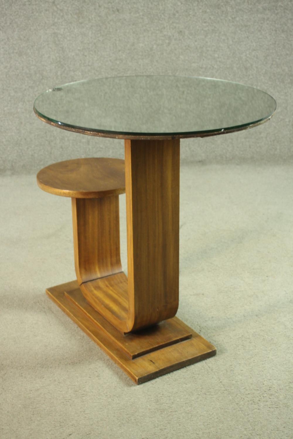 An Art Deco teak table and stool, with a circular glass table top, on a support which curves up to a - Image 8 of 8