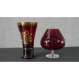 A gilded Ruby glass vase along with a large ruby glass brandy goblet. H.23 Diam.14cm