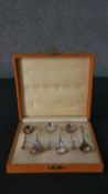 A boxed set of Dutch sterling silver coffee spoons with floral design ends. Marked with fineness