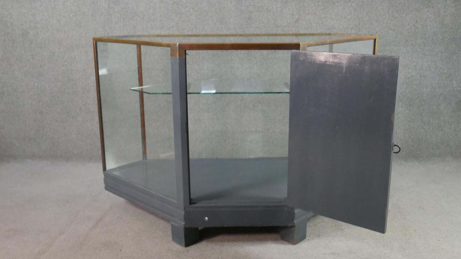 A mid 20th century shop corner display cabinet, glazed, with brass edges, enclosing a single - Image 7 of 7