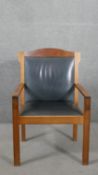 A 20th century cherrywood open armchair, upholstered to the back and seat in stone grey leather,
