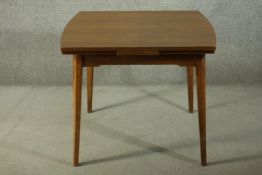 A circa 1930s draw leaf extending dining table, on square section tapering legs. H.75 W.91 D.84cm (