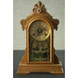 A late 19th century American Ansonia type oak cased mantel clock with eight day movement. H.52 W.