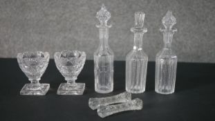 A collection of 19th century cut crystal, including a pair of salts with lemon squeezer bases, a