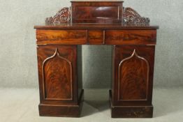A William IV flame mahogany pedestal sideboard, the rectangular gallery back flanked by ornately