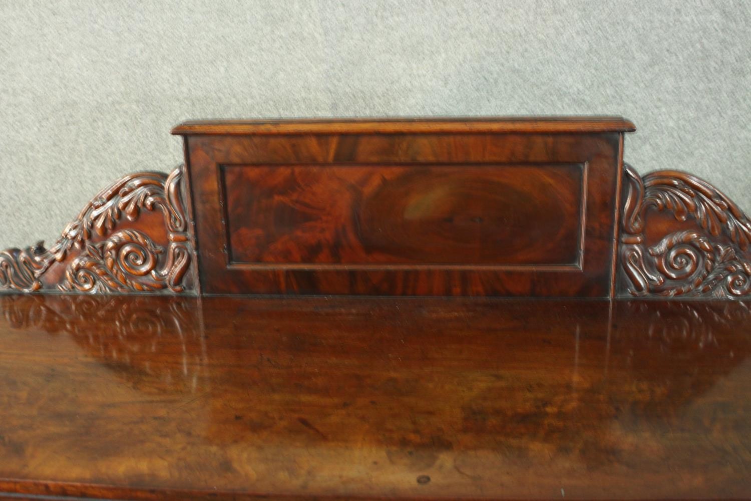 A William IV flame mahogany pedestal sideboard, the rectangular gallery back flanked by ornately - Image 5 of 10