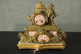 A French 19th century gilt spelter figural design mantle clock. The dial hand painted porcelain as