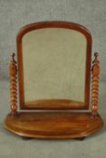 A Victorian mahogany swing framed toilet mirror, with bobbin turned supports. H.71 W.66cm.