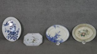Four large ceramic serving dishes, including a Royal Worcester flower and bird platter, a Wedgwood