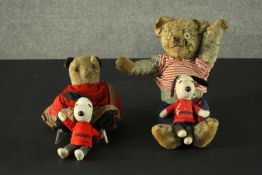 Two antique mohair Teddy bears and two vintage Snoopy toys, each wearing a red Snoopy jumper. H.44cm