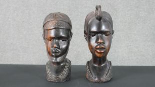 Two carved hardwood African busts. H.27 W.10 D.14cm (largest)