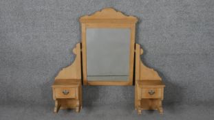 A Victorian pine dressing table mirror section, the rectangular mirror in a swing frame, flanked