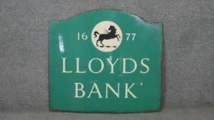 A Lloyds Bank enamel advertising sign, '1677, LLOYDS BANK', with black horse detail. H.61 W.66cm
