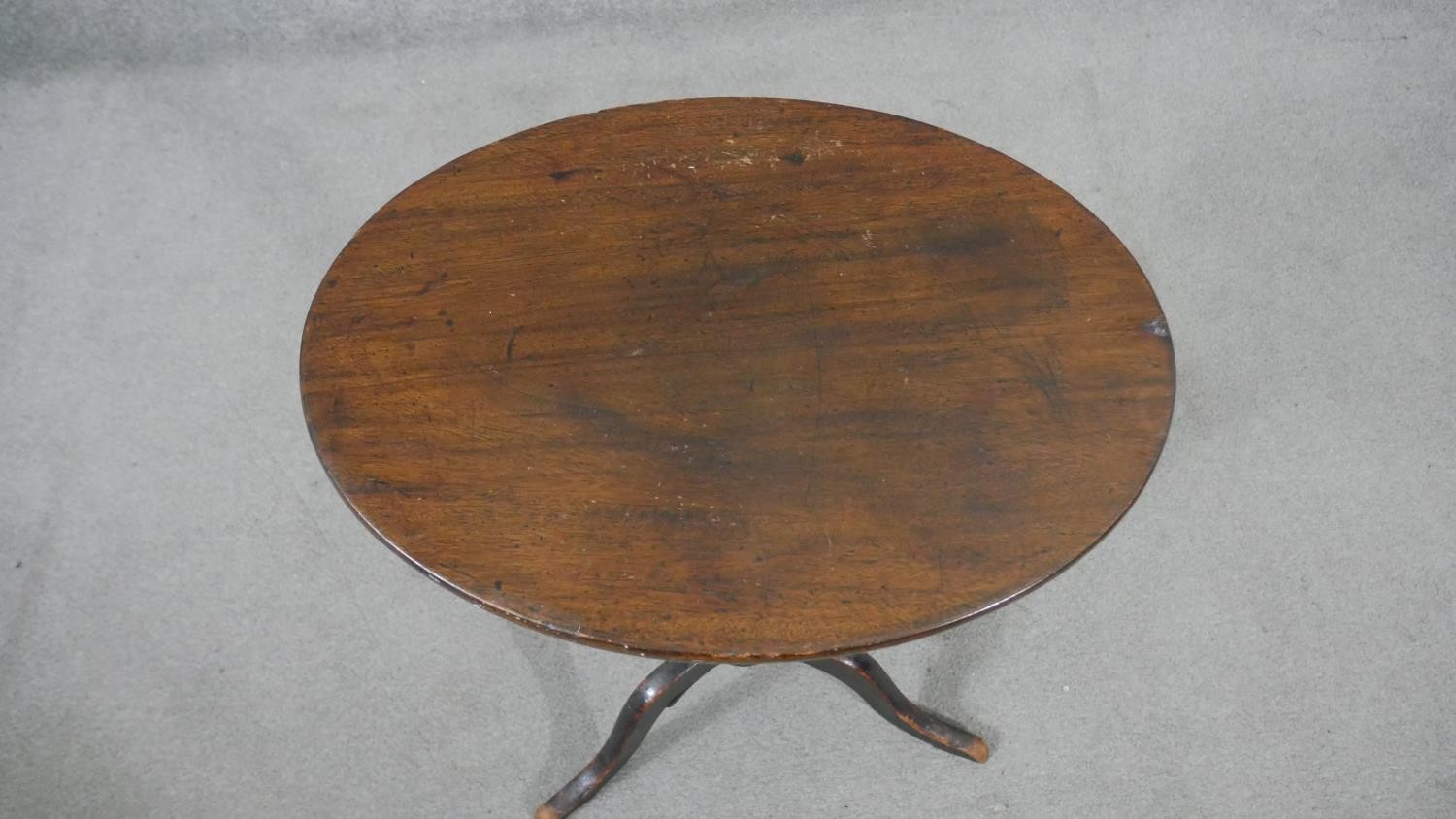 A 19th century mahogany tripod table, with a circular top on a turned stem and tripod supports, - Image 6 of 6