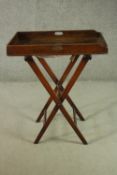 A 19th century mahogany butler's tray, with handles, on a later mahogany folding stand. H.90 W.75