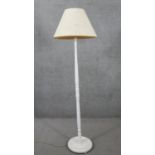A painted carved standard lamp with cream shade. H.180 Diam.36cm