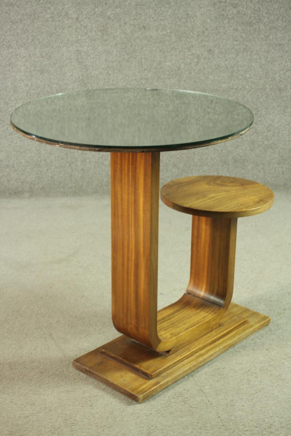 An Art Deco teak table and stool, with a circular glass table top, on a support which curves up to a - Image 4 of 8