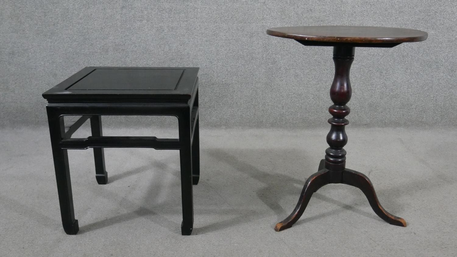 A 19th century mahogany tripod table, with a circular top on a turned stem and tripod supports,