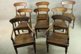 A 19th century country oak set of eight bar back dining chairs, including two carvers and six side