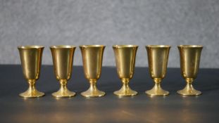 A set of six American gilded sterling silver cordial cups by Revere Silver Company. Stamped