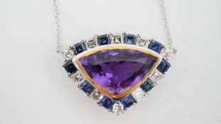 A white and yellow metal (tests as platinum and 18 carat gold) amethyst, sapphire and diamond