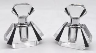 A pair of black and white fan shaped cut glass Art Deco perfume bottles with chrome collars.
