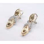 A pair of Italian 14 carat yellow gold and diamond X motif drop earrings. Each earring set with