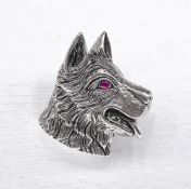 A silver dogs head brooch/pendant with ruby eye and engraved detailing for the fur. Secure hinged