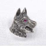 A silver dogs head brooch/pendant with ruby eye and engraved detailing for the fur. Secure hinged