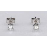 A pair of 18ct white gold and diamond stud earrings. Each earring set with a round brilliant cut