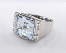 A white metal (tests as 18 carat) aquamarine and diamond Art Deco cocktail ring. Set to centre