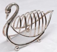 A silver plated toast rack in the form of a swan, with engraved detailing to the head. Sits on