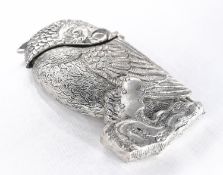A silver plated vesta case in the form of a bird perched on a branch, with engraved detailing.