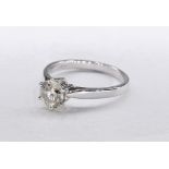 An 18 carat white gold solitaire diamond ring, set with a round brilliant cut diamond with an
