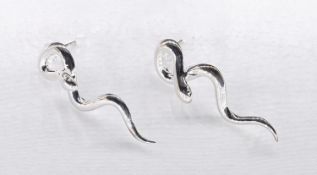 A pair of cotemporary polished silver snake stud earrings with butterflies. Stamped 925.