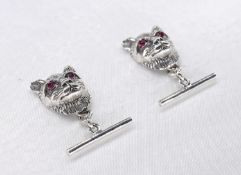 A pair of silver cat head chain link cufflinks with garnet eyes. Stamped Sterling.