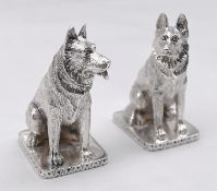 A pair of novelty German Shepherd form silver salt and pepper shakers. Engraved detailing on the fur
