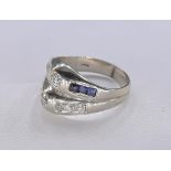 A vintage 14 carat white gold sapphire and diamond dress ring. Set with two round old mine