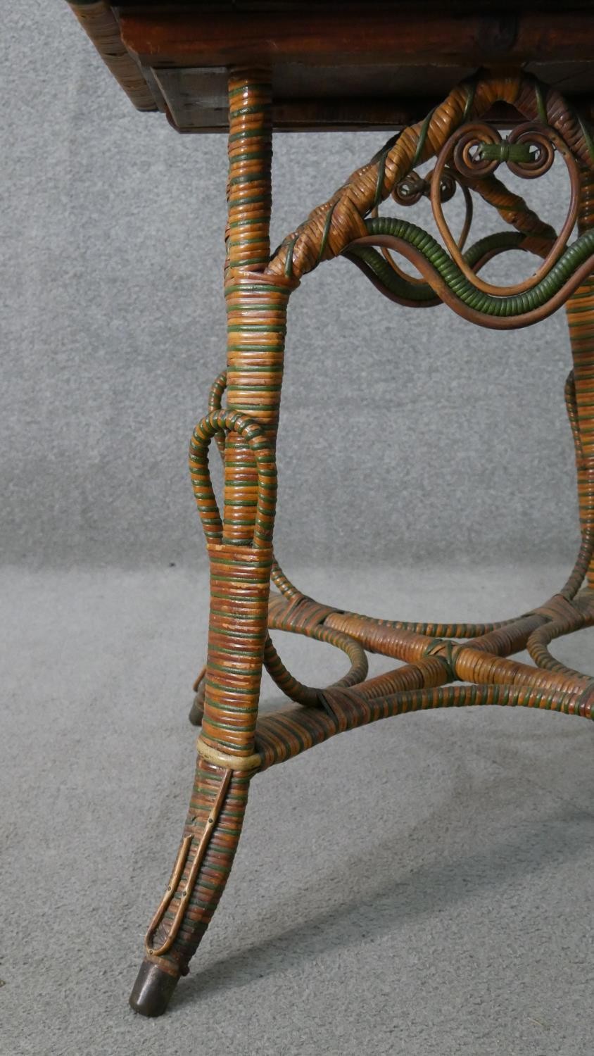 A wicker occasional table, the square top with green foliate Art Nouveau tiles, the splayed legs - Image 4 of 7