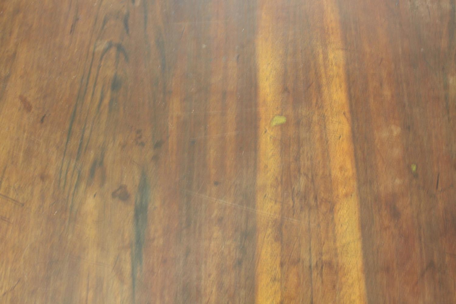 A Victorian mahogany library table, with three short drawers, over end supports joined by a turned - Image 3 of 9