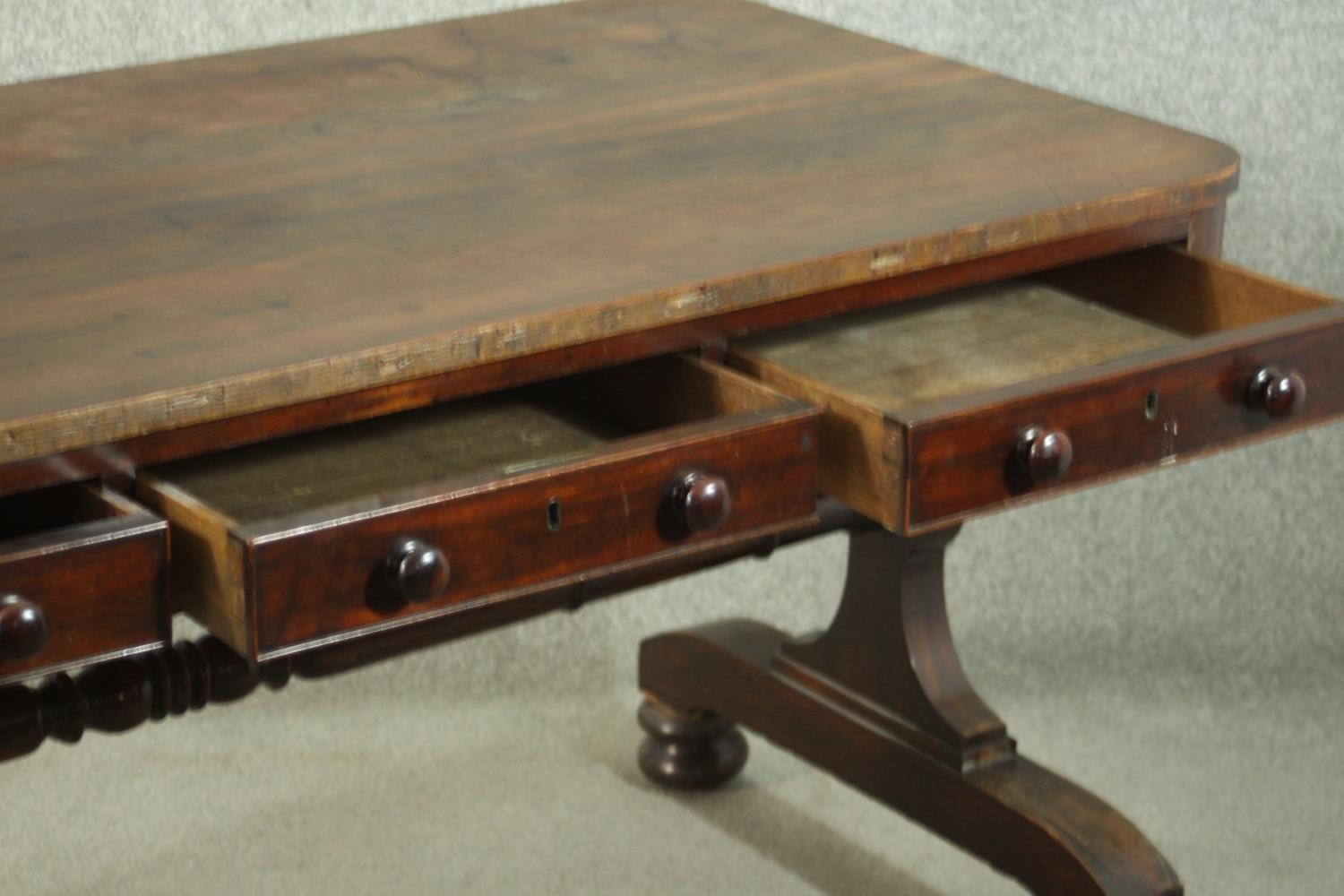 A Victorian mahogany library table, with three short drawers, over end supports joined by a turned - Image 6 of 9