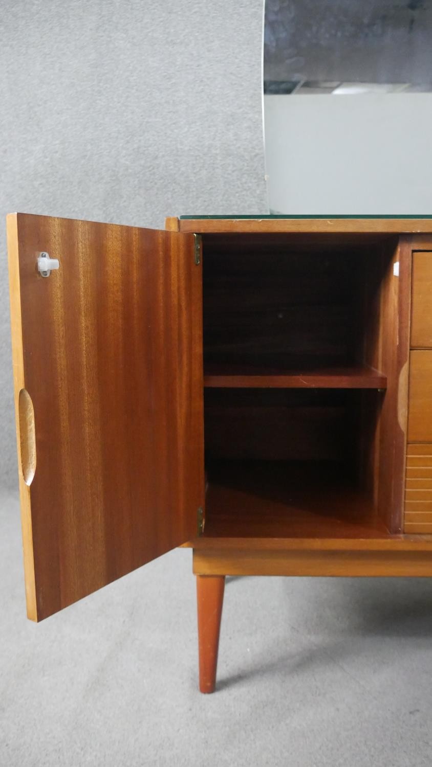 A circa 1960s teak dressing table, with a frameless mirror over three short drawers flanked by - Image 5 of 8