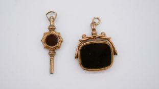 A Victorian 9 carat rose gold sardonyx and agate swivel fob along with an engraved gold plated watch