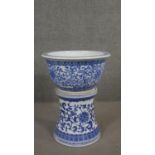 A Chinese blue and white porcelain jardinière on waisted plinth base, flowers and foliage with Greek