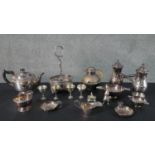 A large collection of silver plate, including a pair of cafe au lait pots, egg cups, sugar bowl,