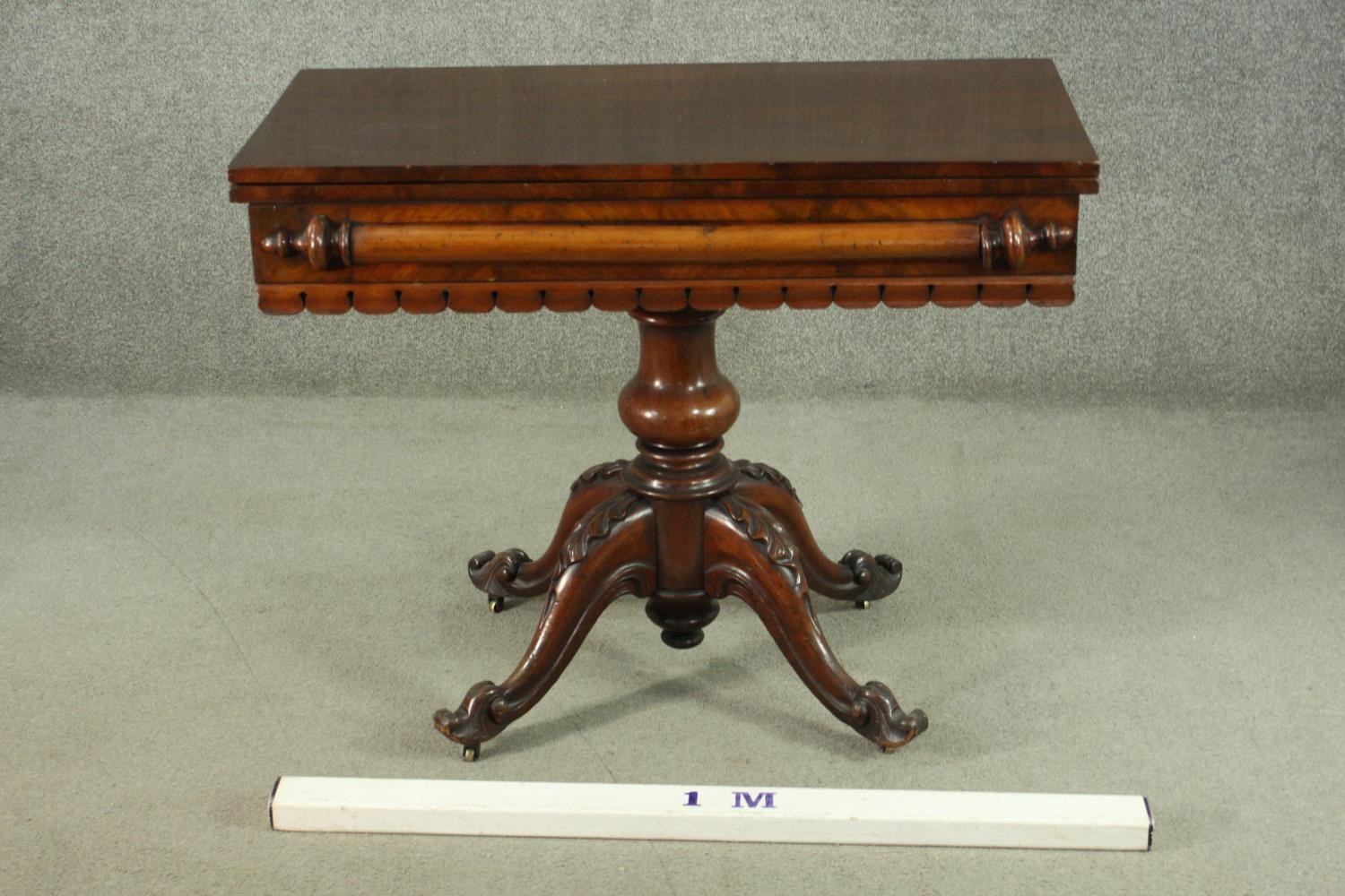 A Victorian figured walnut tea table, with a foldover top, over a baluster stem, on a quatraform - Image 2 of 7