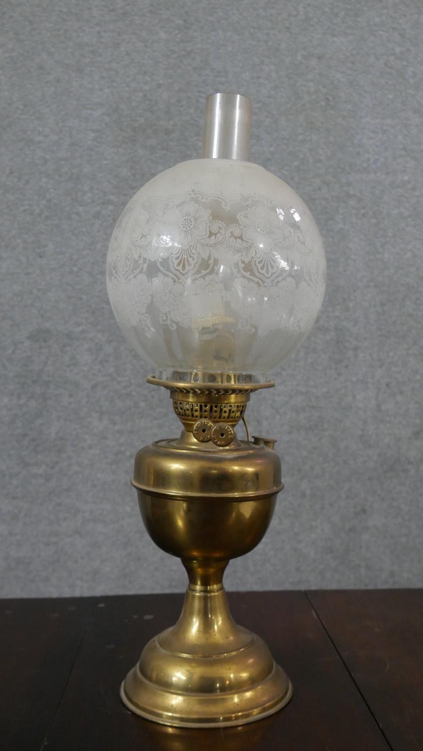 A Victorian brass converted oil lamp, with a globular etched glass shade. H.52 W.15cm - Image 2 of 6