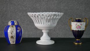 A collection of hand painted porcelain, including a Mintons twin handled pink rose design urn (lid