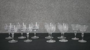 A collection of cut crystal glasses, including a set of five Webb crystal wine glasses, two Webb