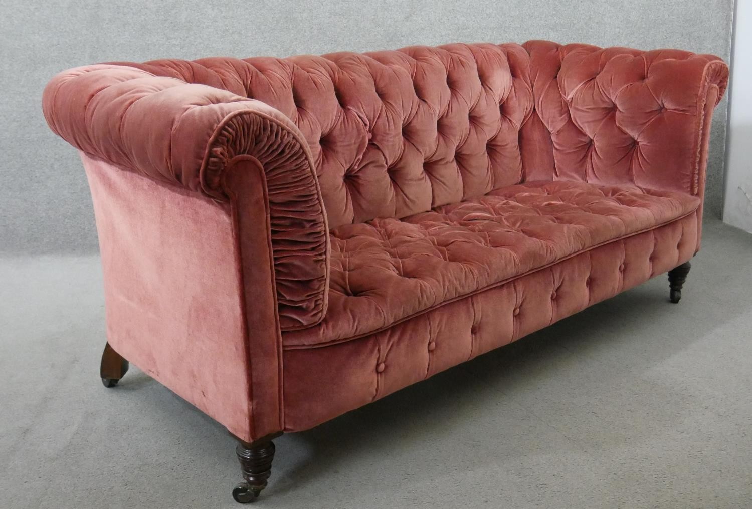 A Victorian Chesterfield sofa, upholstered in pink velour, buttoned to the back, arms, seat and - Image 6 of 6